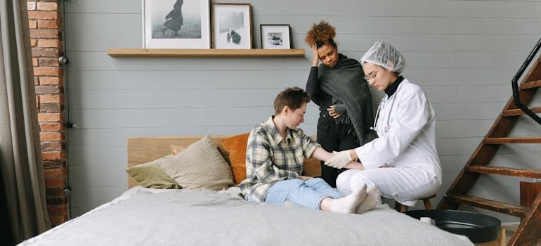 Woman getting her blood drawn at home to monitor her Ambien addiction 