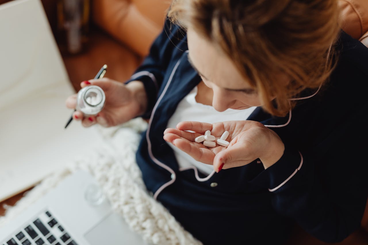 A woman holding pills as a symbol of tramadol overdose