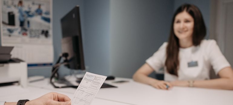 Doctor discussing OxyContin addiction with a patient during a medical appointment.