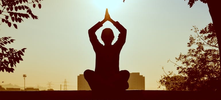 Woman doing yoga outdoors.