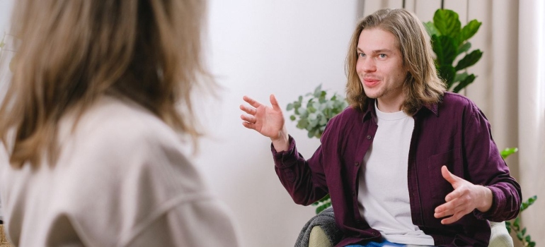 Man speaking with a therapist during a counseling session.