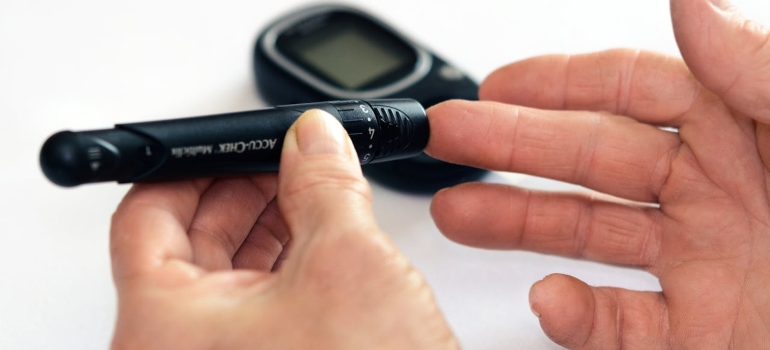 a person checking his blood sugar 