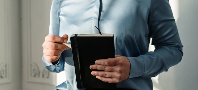 Therapist holding a notebook.