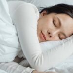 Woman sleeping and enjoying 7 days without alcohol