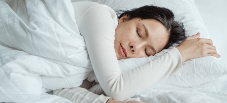 Woman sleeping and enjoying 7 days without alcohol