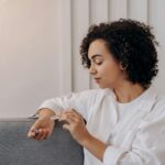 Woman sitting on her couch