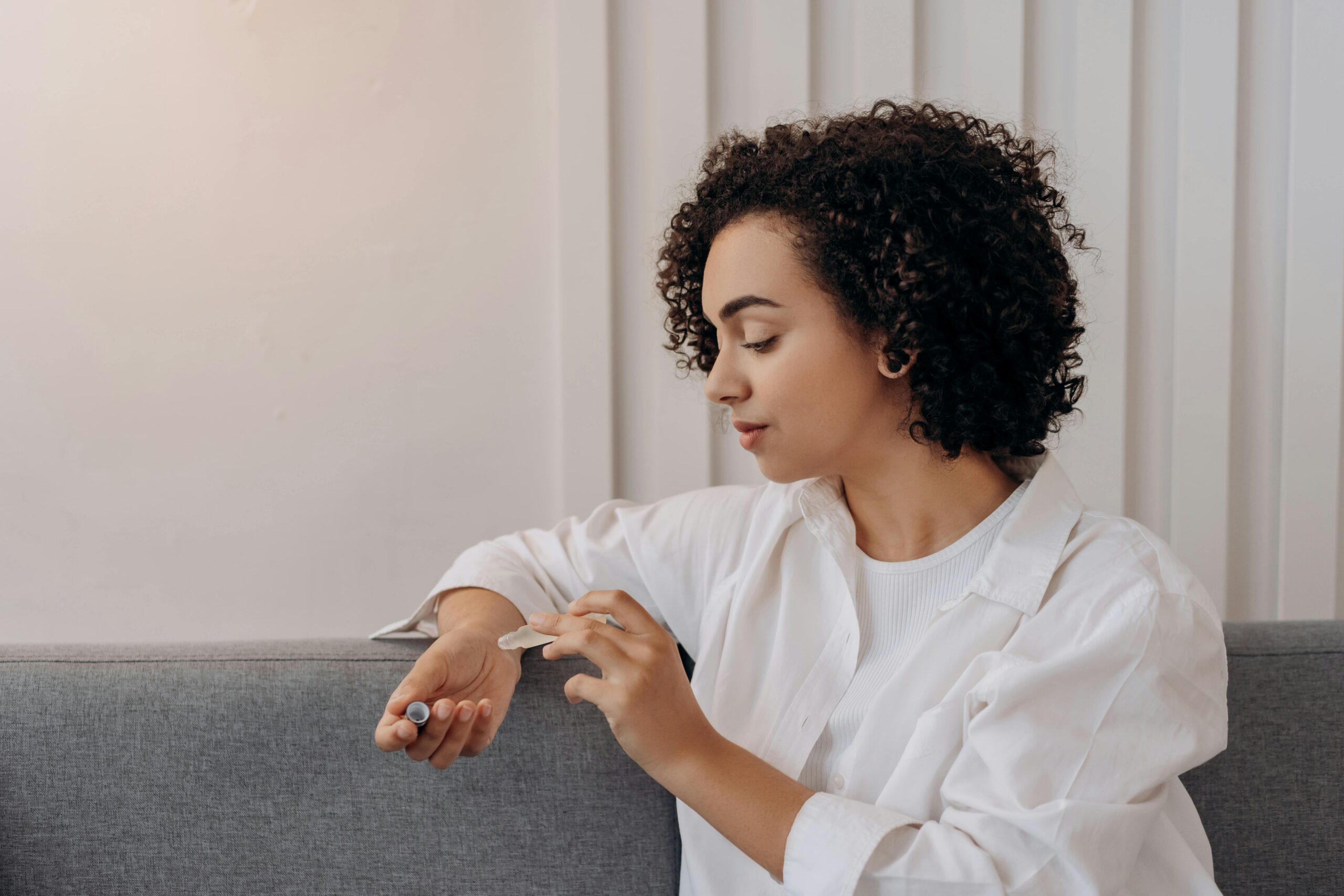 Woman sitting on her couch