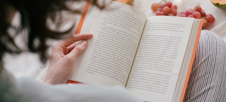 Woman reading a book on sober living