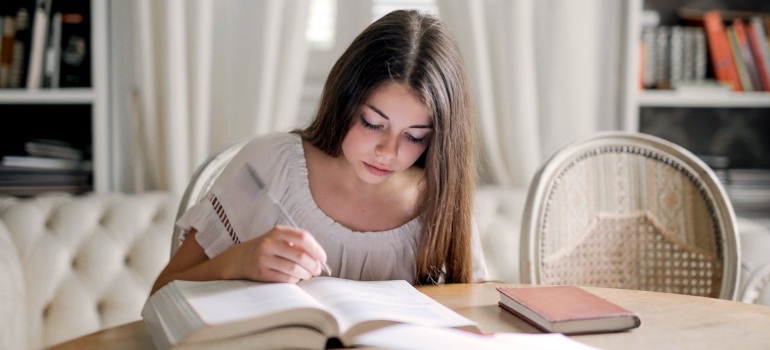 Girl studying from books.