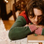 Man experiencing holiday blues symptoms.