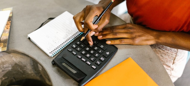 Woman uses calculator