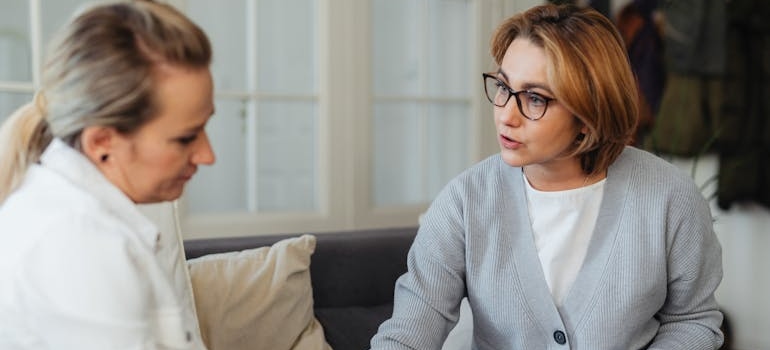 Therapist supporting her client who is dealing with binge drinking and depression.