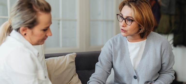 Therapist talking to a female patient about inhalant abuse.