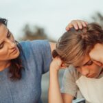 Woman supporting and helping a child whose parent is struggling with addiction.