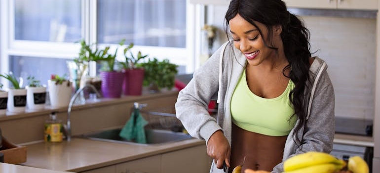 Woman making a fruit salad.