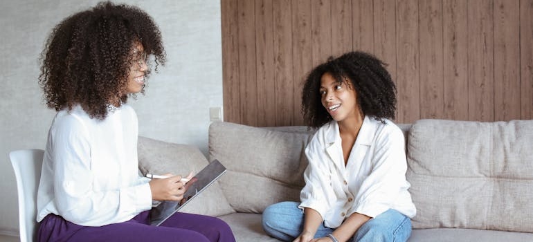 Woman talking to her therapist about the difference between MDMA and Ecstasy.