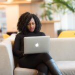 Woman researching FAQs about addiction treatment.