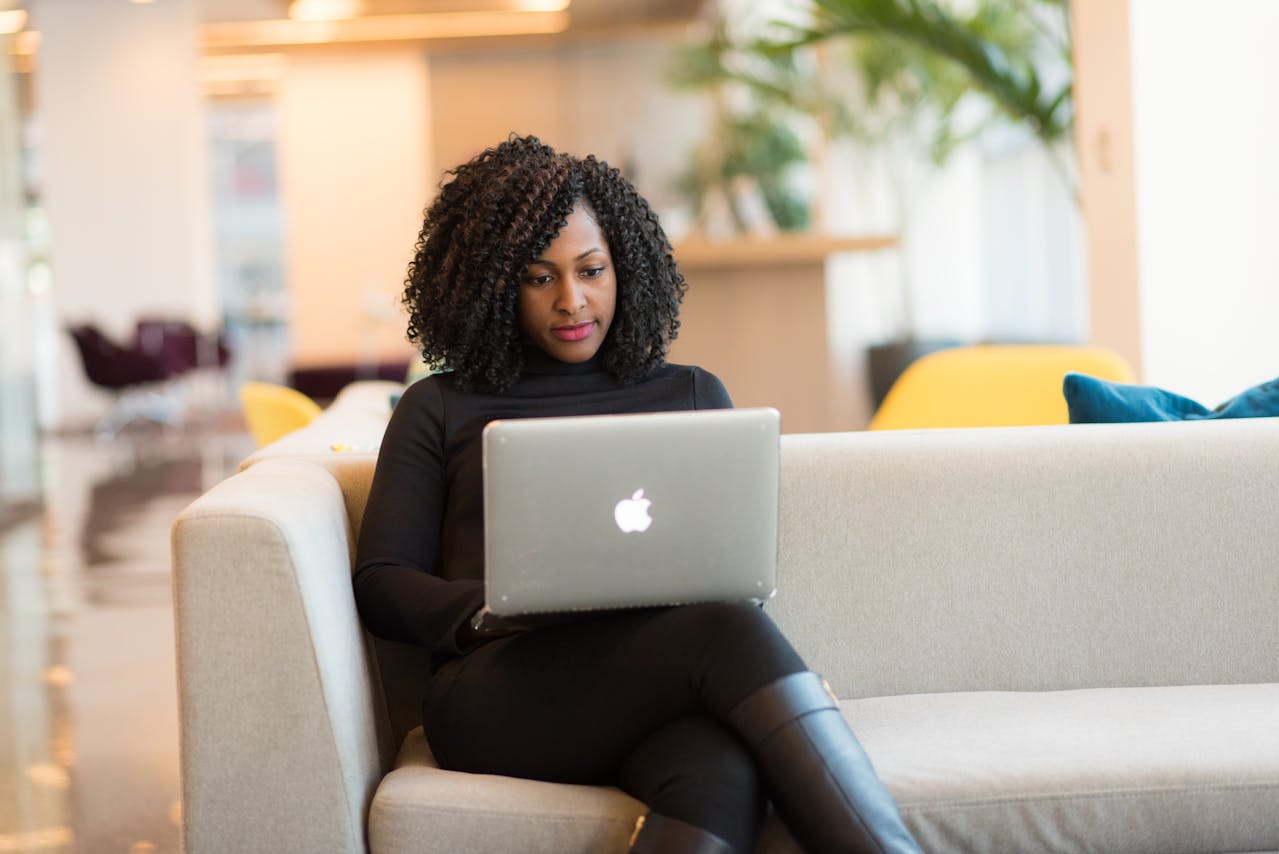 Woman researching FAQs about addiction treatment.