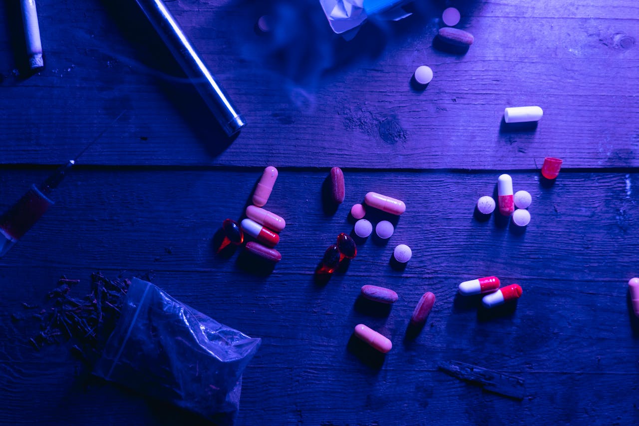 Pills on a wooden table.