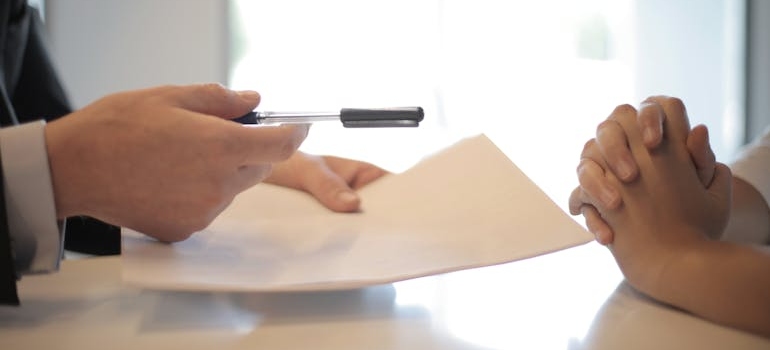 Person receiving paperwork about how long do prescription painkillers stay in your system.