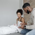 Man giving woman a gabapentin pill after wondering does gabapentin help with opiate withdrawal.