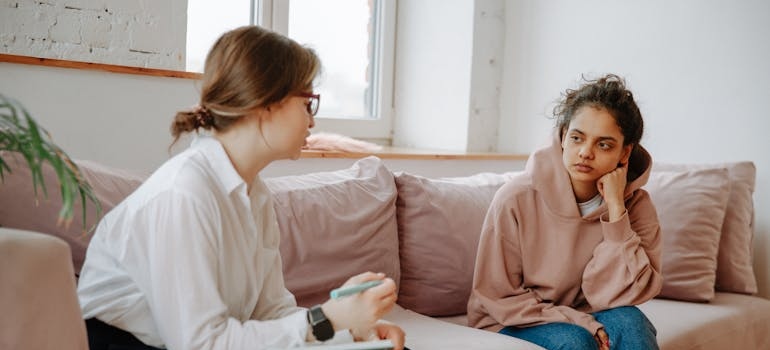 Therapist talking to a depressed patient.