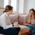 Woman struggling with BPD and alcohol use talking to a therapist.