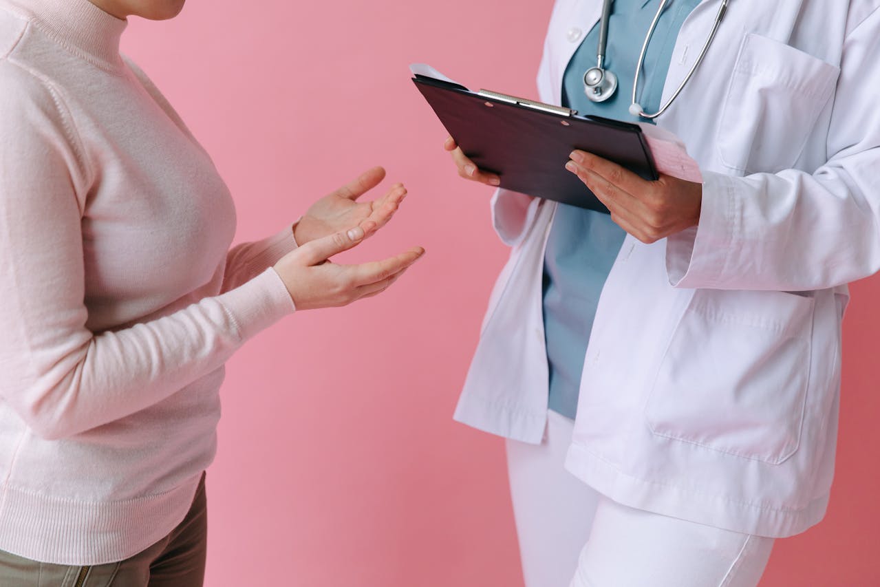 Woman talking to a doctor about her tailored detox programs.