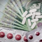 Blisters of pills on top of money.