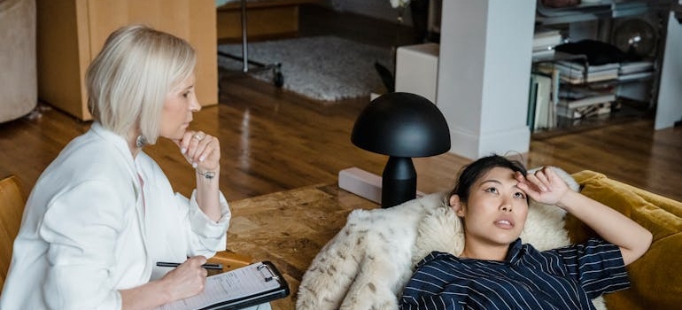 Therapist talking about the benefits of sobriety with her patient.