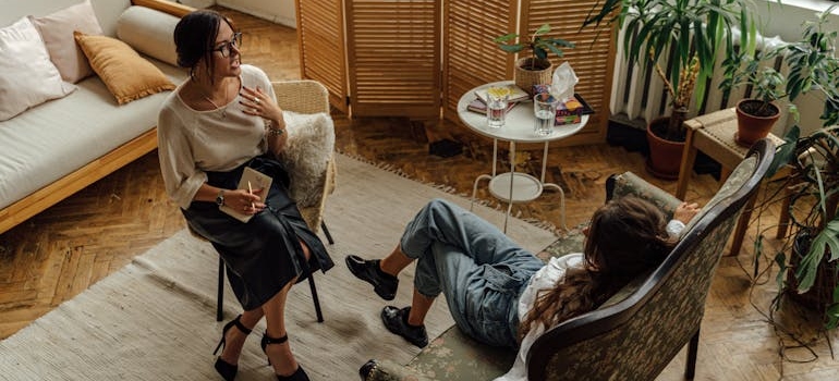 Woman talking about mental wellness with her therapist.