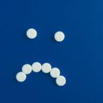 Blues pills on a blue background.
