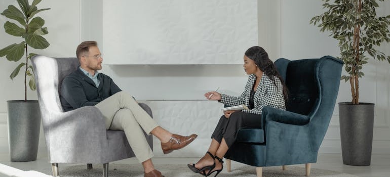 Therapist talking about drug rehab success rates and statistics with her client.