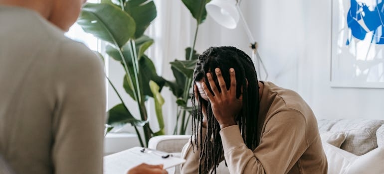 Man discussing his issues with addiction to his therapist.