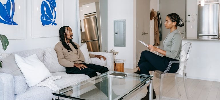 Therapist explaining principles of CBT to a patient.