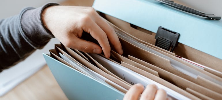 Person going through a folder.