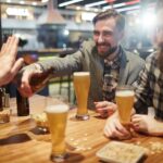 Friends offer beer to a person who is trying to cut back on drinking.