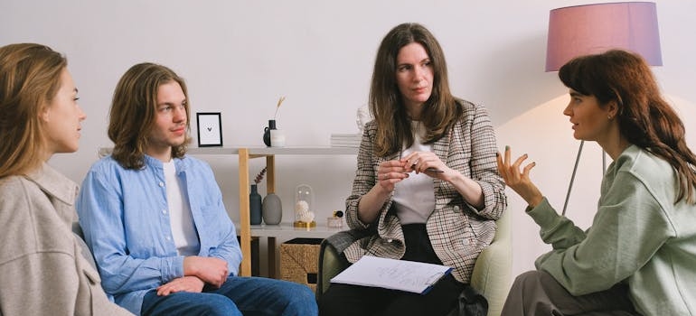 People in group therapy discussing their issues.