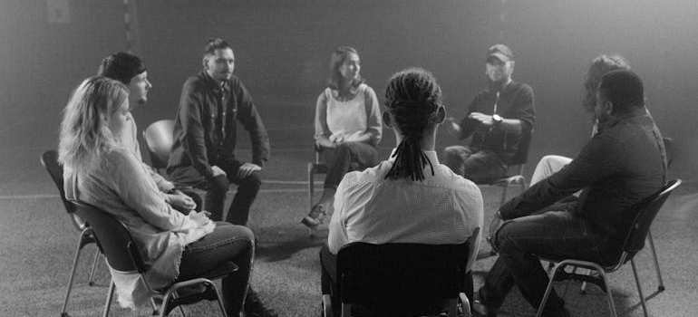 People in a support group talking about their shared issues.