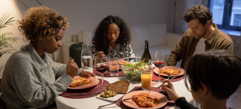 Family having dinner and feeling the devastating impact of substance use on families.