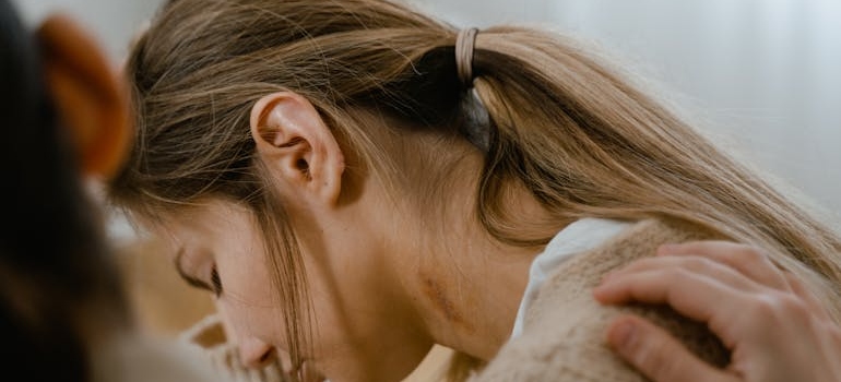 Woman supporting her sad friend through a hard time.