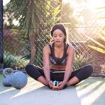 Woman stretching before starting with exercise and addiction recovery.