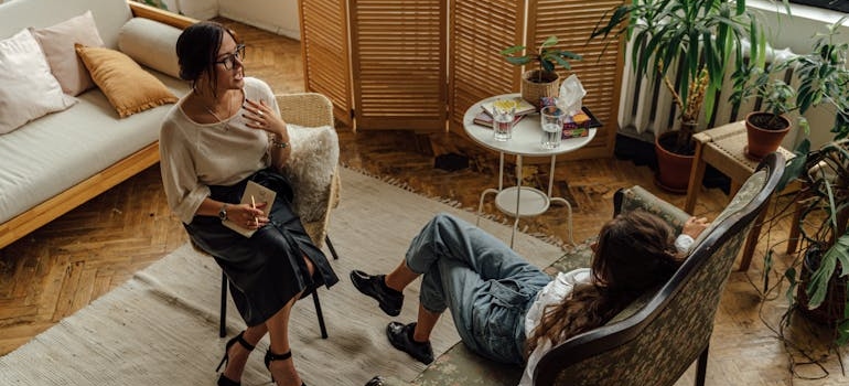 Woman talking about her struggles with benzodiazepines and PTSD with her therapist.