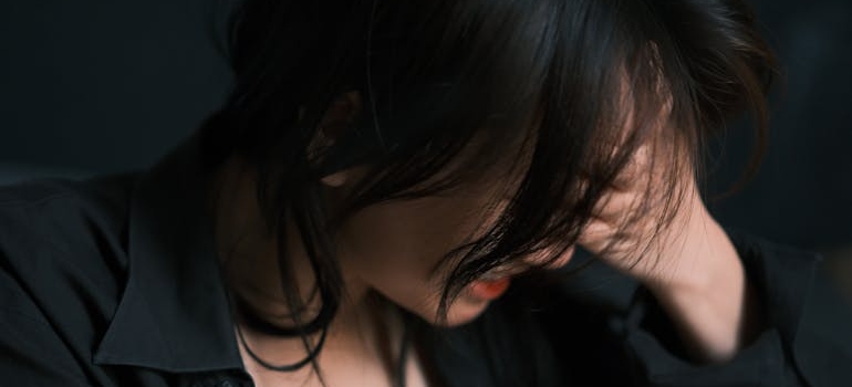 Woman having problems with breathing while experiencing prescription medication overdose.