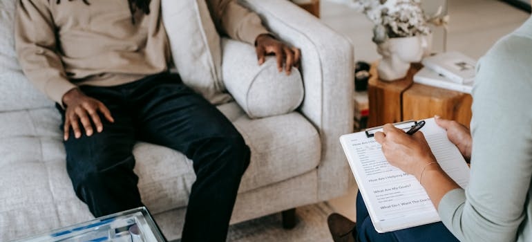 Man talking to a therapist in mental health and addiction treatment.