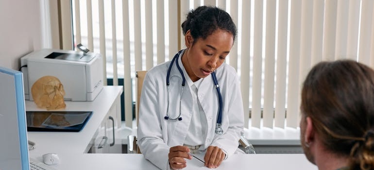 Doctor prescribing medication to her patient.