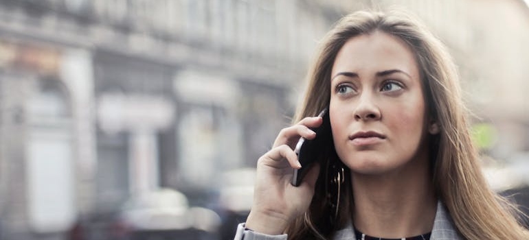 Woman making a phone call in the street.