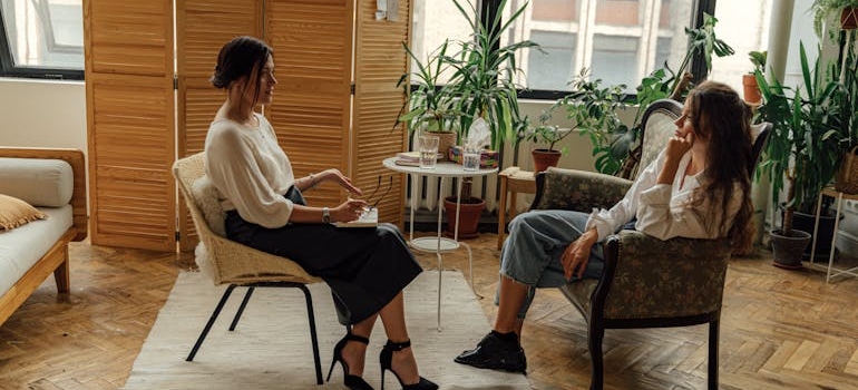 Woman talking about trauma and depression with her therapist.