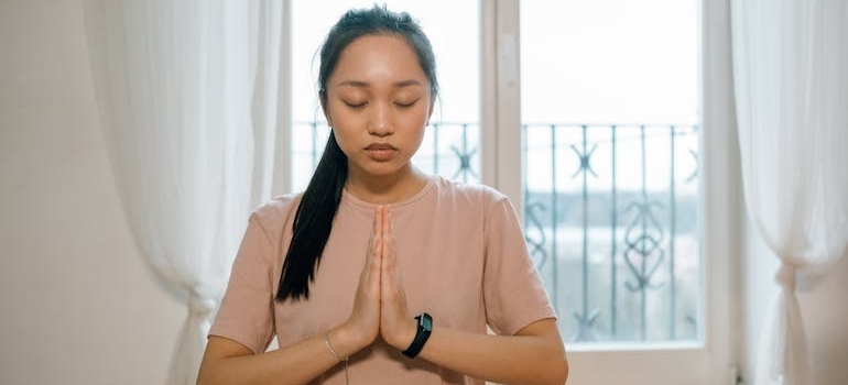 Woman doing yoga to help rebuild a healthy mind and body.