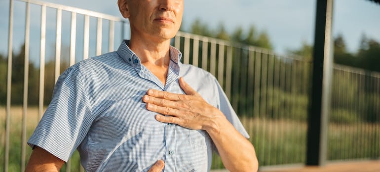Man practicing breathing exercises.